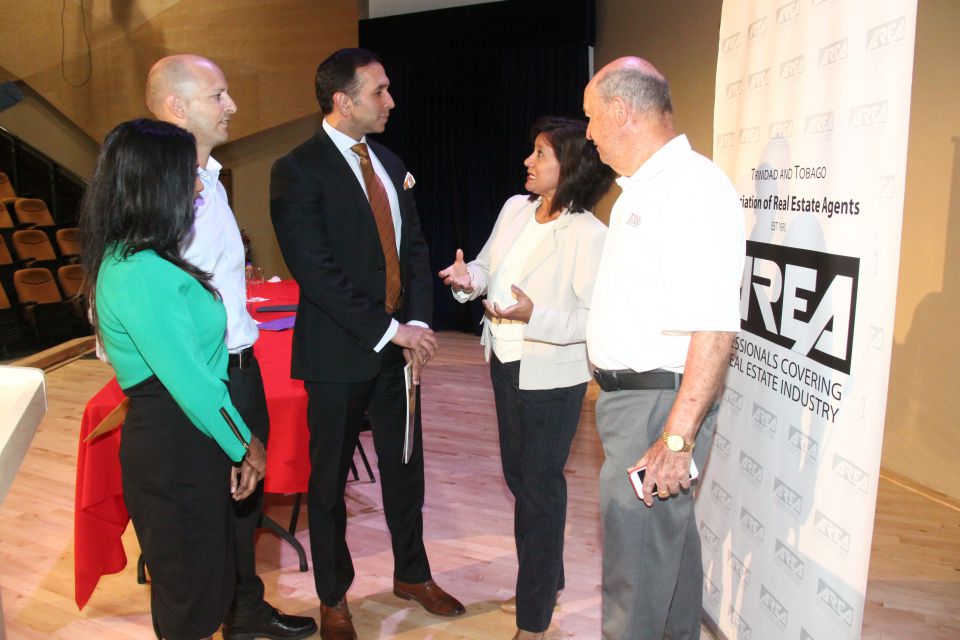 (left to right) AREA President, Sally Singh chat with Jean-Paul de Meillac of Terra Caribbean Trinidad, the Hon. Attorney General Mr. Faris Al-Rawi, Jo-Ann Traboulay and Jean de Meillac of Terra Caribbean
